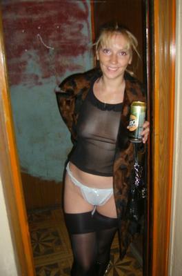 Blonde Mature opens her legs