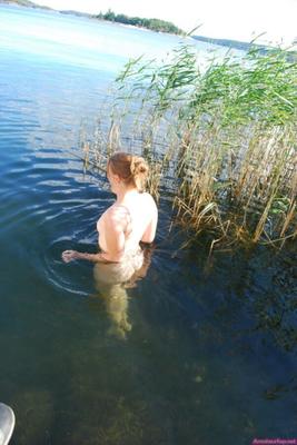 Cute Blonde Taking A Bath Outdoors